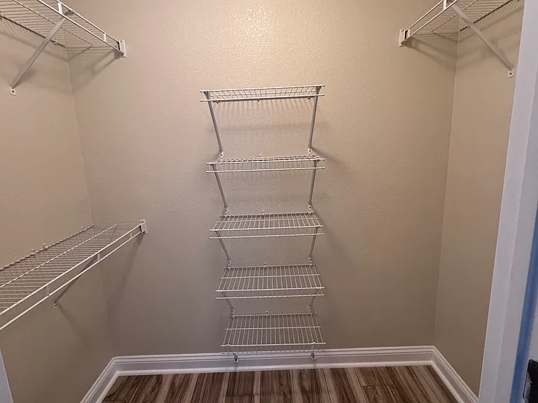 Guest bedroom's closet with shelving.