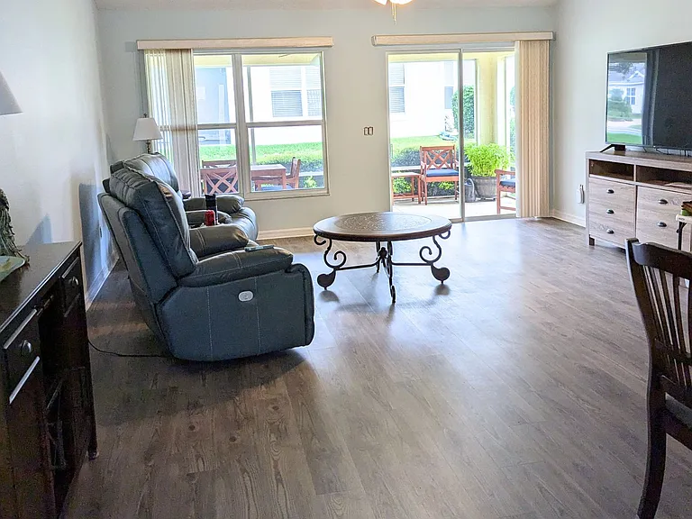 Open Living Room with Valuted Ceilings and LVP Floors.