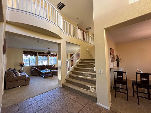 high ceiling with beautiful staircase