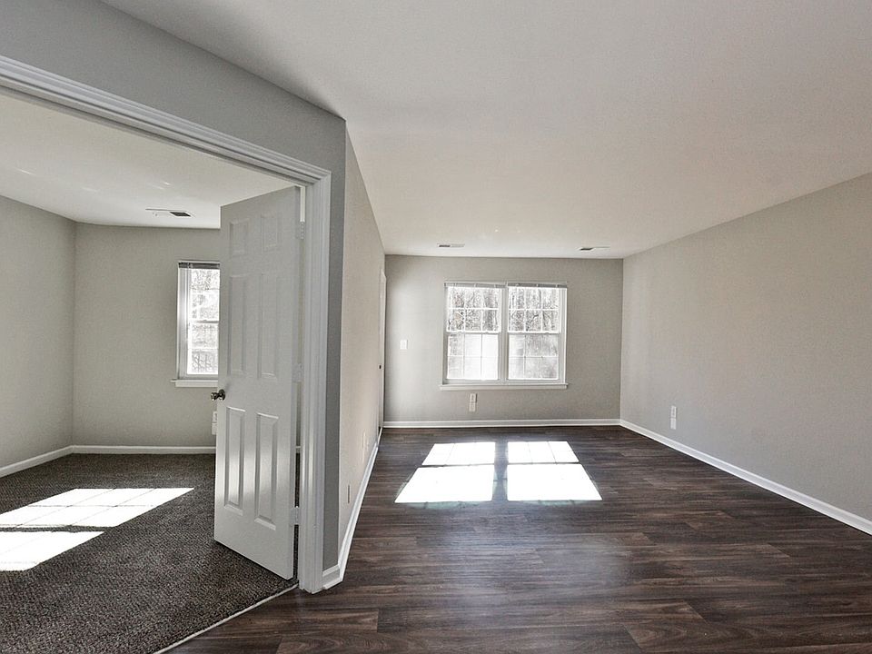 Spacious living room with hardwood-style flooring