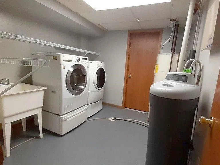 Lower level utility room (includes water softener, washer & dryer)
