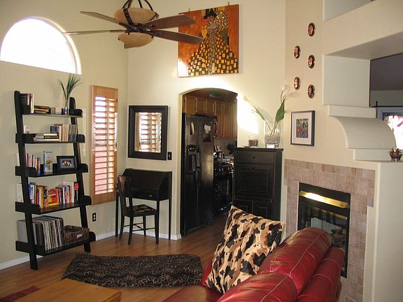 Vaulted ceiling with upgraded ceiling fan.  Note fireplace is double sided 