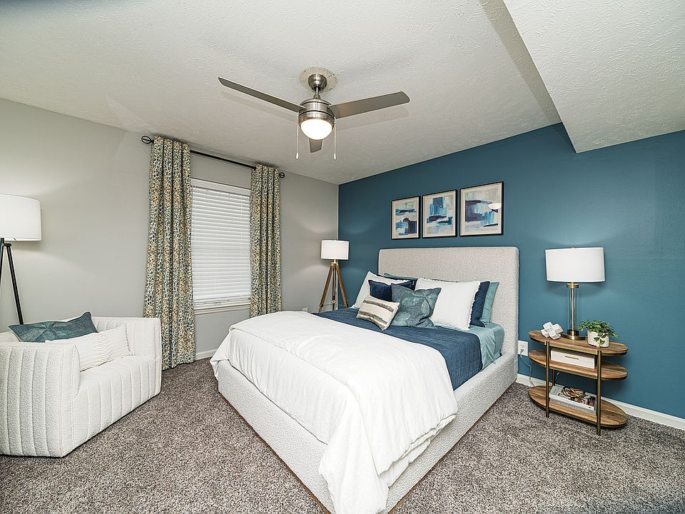 Bedroom with carpet & ceiling fan