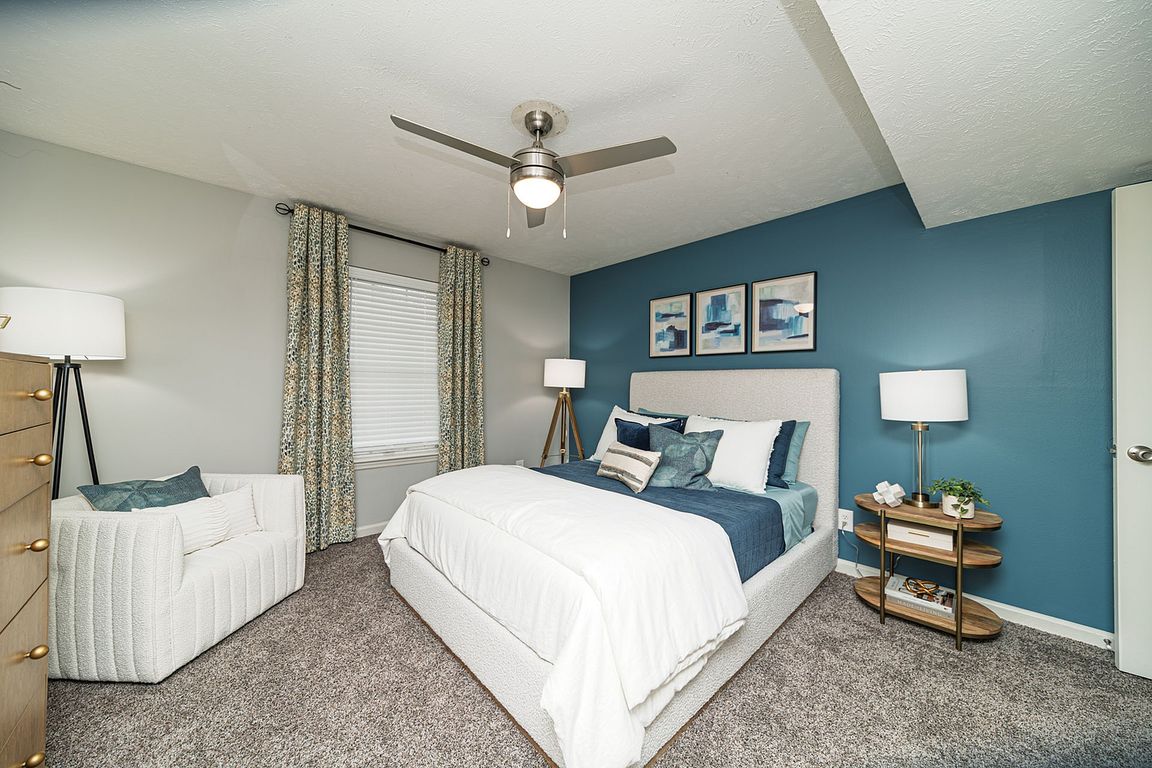 Bedroom with carpet & ceiling fan