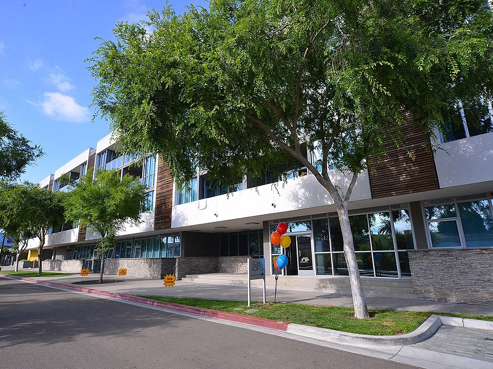 Nice tree-lined sidewalk in front of 12th Street Lofts in National City, California.