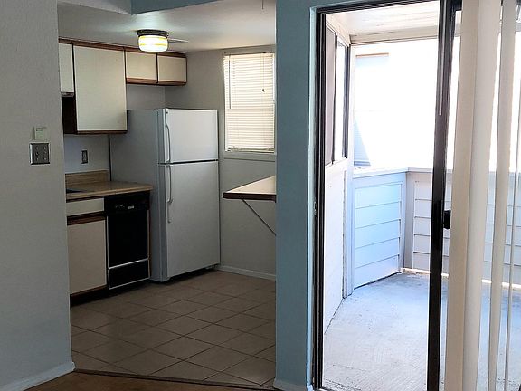 Kitchen, patio with washer/dryer closet.