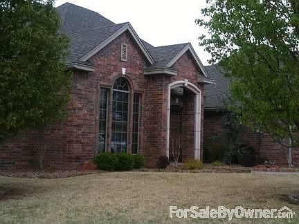Front of home, from corner of lot. : Beautiful lawn acented with trees and schrubry. Three bedrooms,