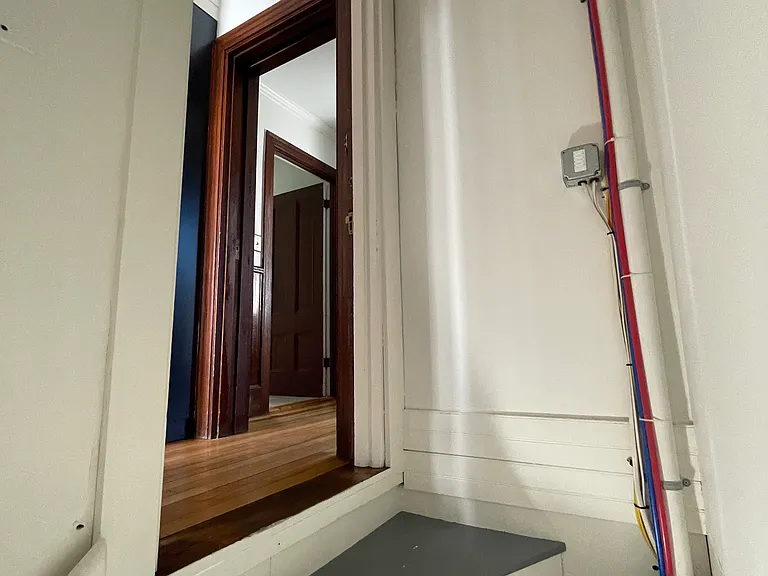 Interior kitchen door down to basement.