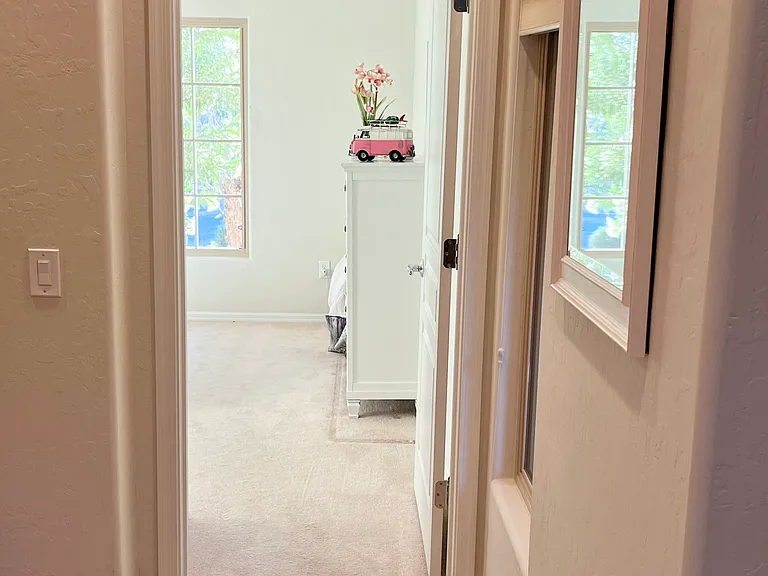 Entry to second bedroom on opposite end of the house from the primary bedroom.