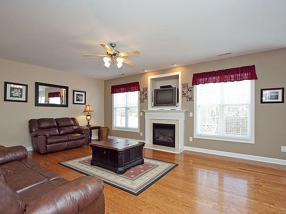 Cozy family room has abundance of natural lighting