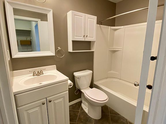 Upgraded bathroom attached to laundry.