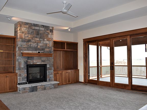 cozy fireplace, lots of custom cabinets for media and display