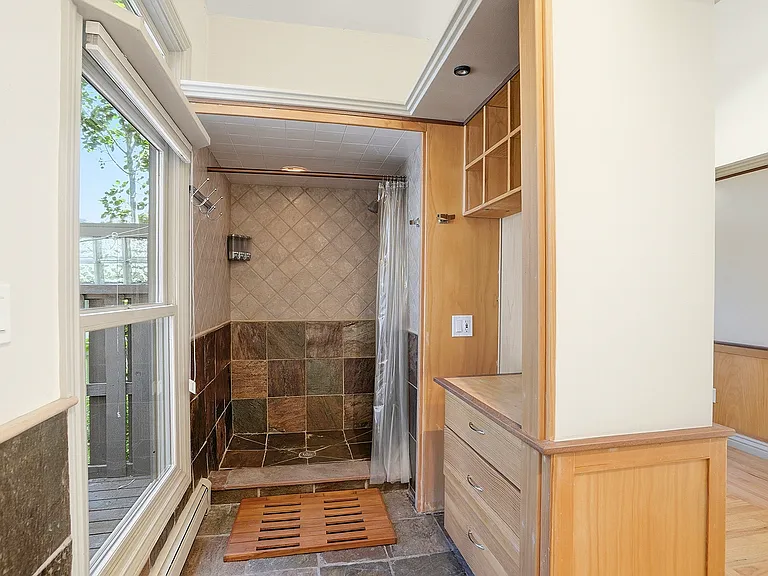 Thoughtfully positioned between the home and outdoor retreat, this versatile wellness space includes a convenient shower and direct access to the backyard amenities.