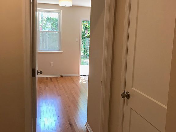 First floor bedroom with door to backyard