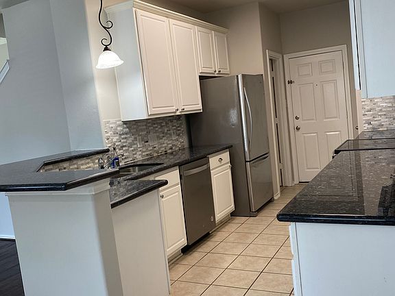 Generous sized kitchen with new fridge and lots of cabinets