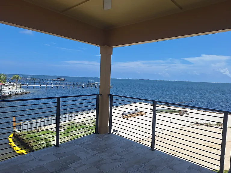 Covered porch with views of the ICW and canal