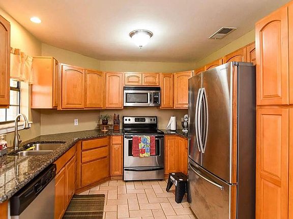 All stainless steel appliances with plenty of cabinets and a full size pantry.