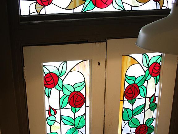 Front inside early 1900's stained glass entrance door First Floor Apartment.