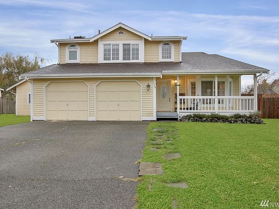 This 4 bedroom, 2.5 bath charmer features a covered porch & 2 car garage.