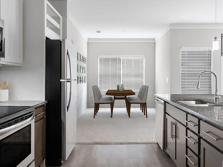 Brand new homes with modern kitchens that include two-tone cabinetry and tile backsplash