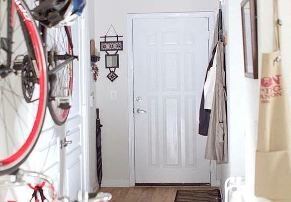 View of front door from kitchen