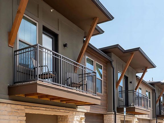 Apartment Exterior Showcasing Private Balcony Access