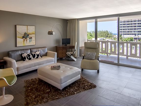 Another view of the living room. Sliding glass doors are hurricane impact!