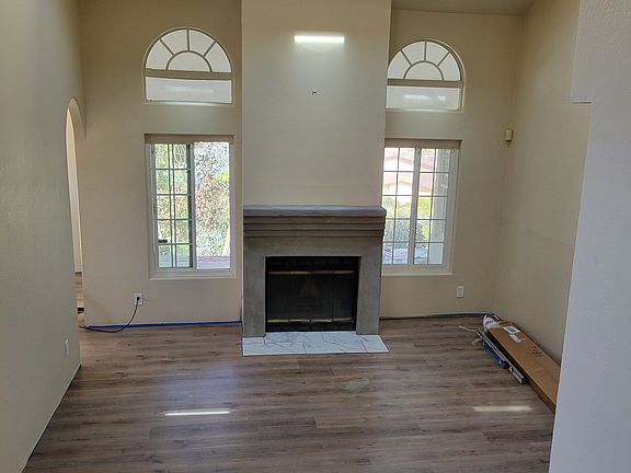 Living room with fireplace & View