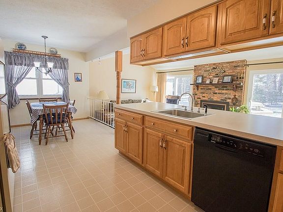 The Kitchen offers beautiful hard maple cabinetry with pull out tray shelving and neutral color linoleum flooring extending into