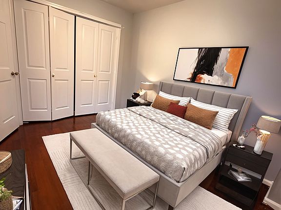 Smaller bedroom with new closet behind folding doors, new blinds (not shown), new door