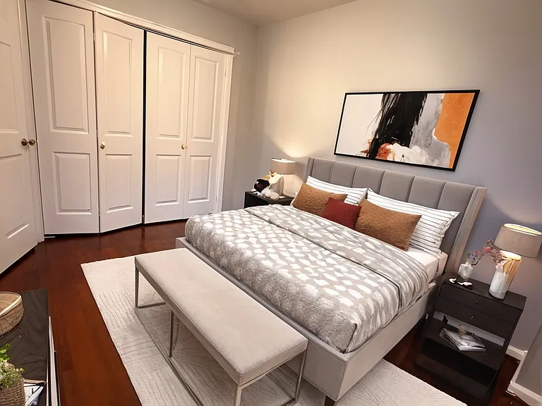 Smaller bedroom with new closet behind folding doors, new blinds (not shown), new door