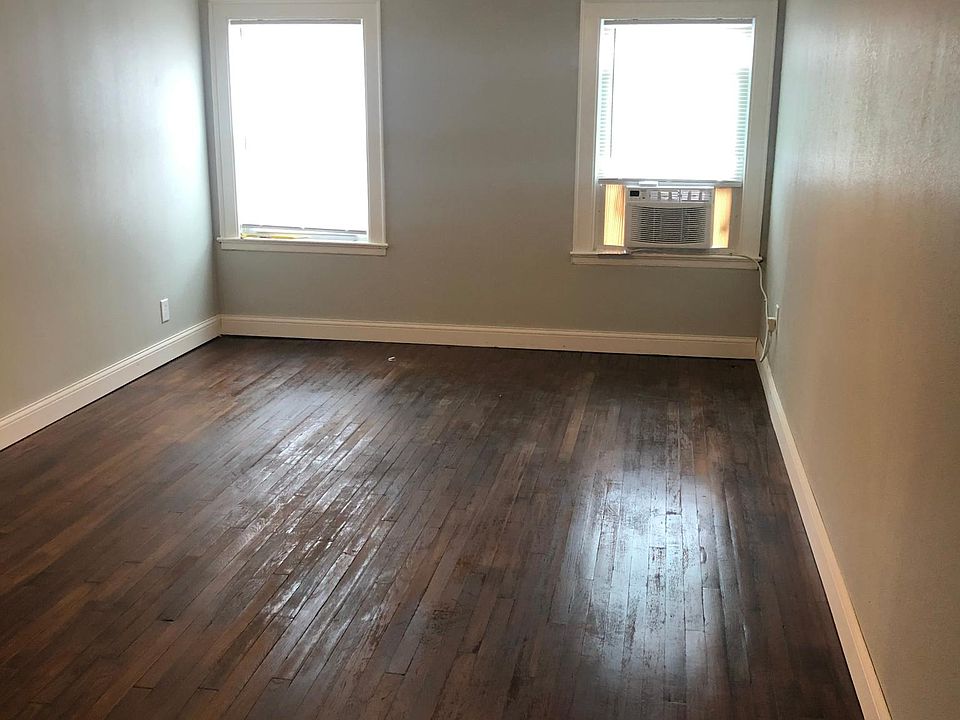 Remodeled Livingroom with window air-conditioner and remote control ceiling fan.