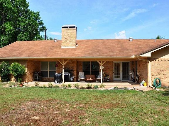 "Extended patio featured on back of home"