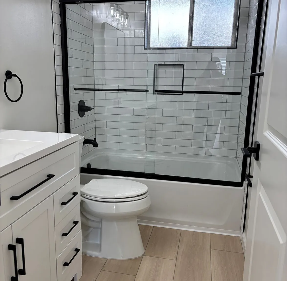Modern tiled bathroom featuring sleek finishes, updated fixtures, and a fresh, contemporary look designed for comfort and style.