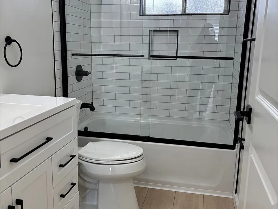 Modern tiled bathroom featuring sleek finishes, updated fixtures, and a fresh, contemporary look designed for comfort and style.