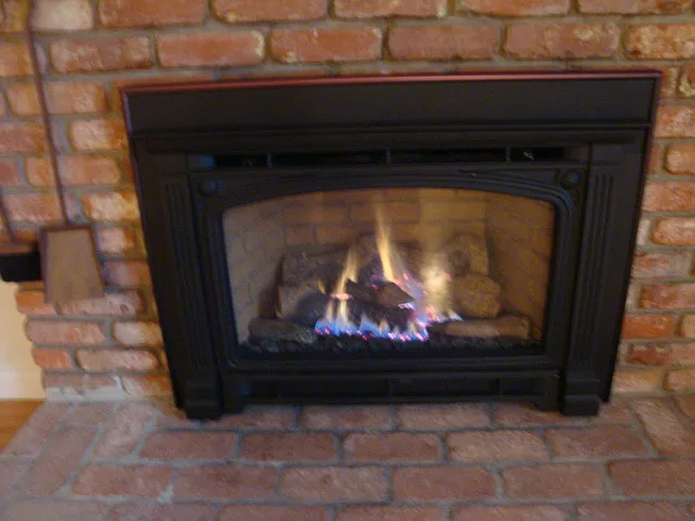 Gas fireplace in living room with remote control