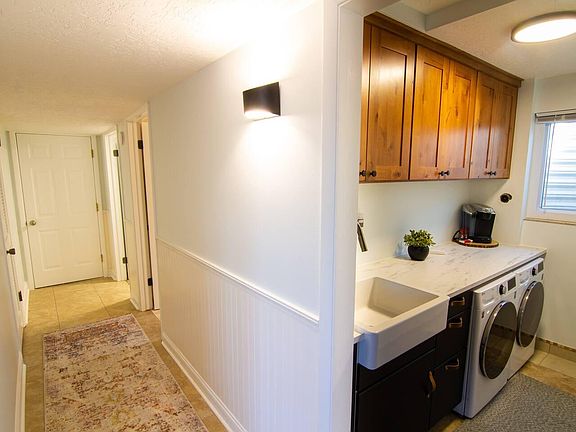 Kitchenette off hallway, bathroom, storage closet