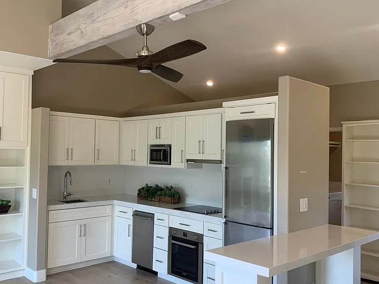 Full kitchen with beautiful countertops and backsplash. Custom cabinets that are maple lined and have a " soft close" feature.