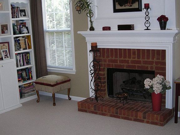 Lovely family room w/ brick fireplace.