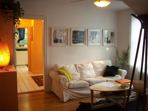 Living room looking into dining / kitchen - before renovation