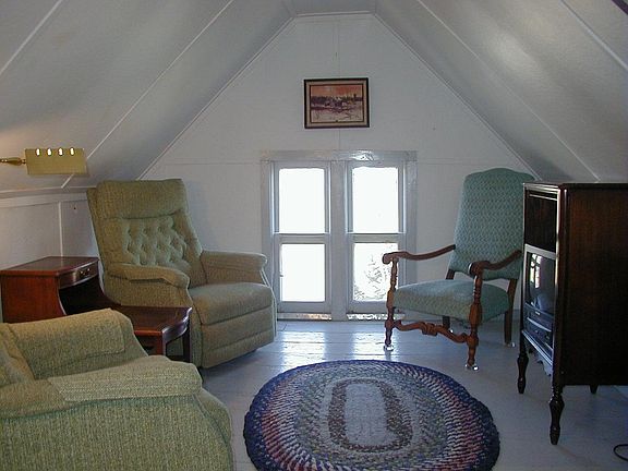 Relax in a recliner in the gable overlooking the park and gazebo