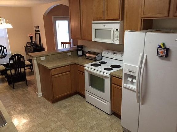 Kitchen with Microwave, stove, refrigerator. Eat in kitchen.