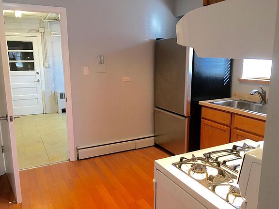 Kitchen and view of Laundry area