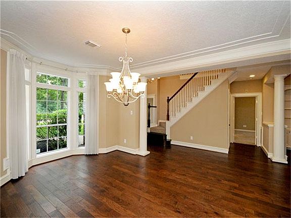 To the right off the foyer is a spacious dining room that will easily accommodate almost any sized dining room suite.
