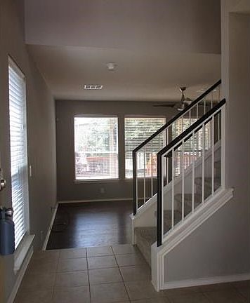 Foyer with half bath located to the right.