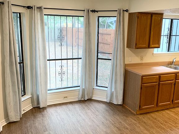 Dining area leading into Kitchen and backyard.
