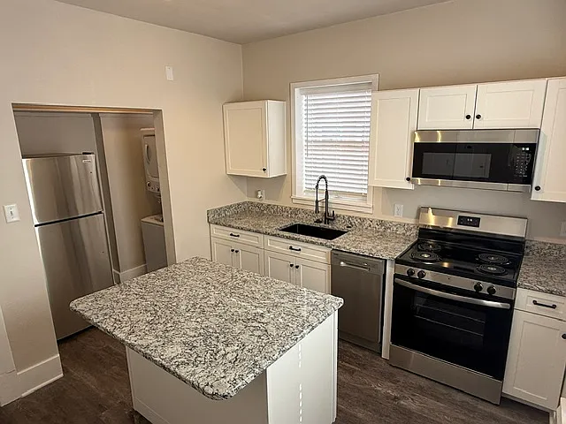 All new kitchen with granite, stainless steel and upgraded cabinets