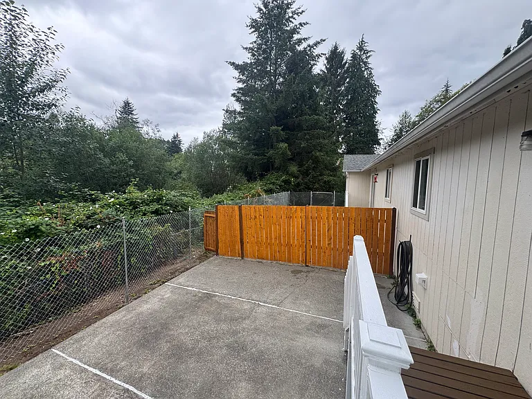 Private fully fenced backyard backing onto Jennings Park, offering a peaceful setting for relaxing and enjoying the outdoors.