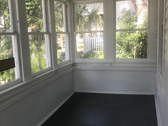 Left side of enclosed front porch