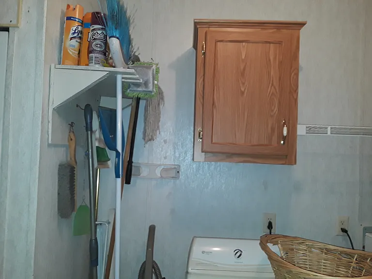 Shelf to hang broom / mops
cabinet 1 of 2 for storage Wire rack